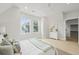 Bedroom with natural light, complemented by a clean white dresser and light wood floors at 868 Tripe St, Charleston, SC 29407
