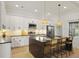 Well-appointed kitchen with a spacious island, pendant lighting, and white cabinetry at 868 Tripe St, Charleston, SC 29407