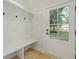 Bright mudroom with a built-in bench, storage, and convenient access to the outdoors at 868 Tripe St, Charleston, SC 29407