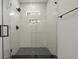 Elegant walk-in shower with modern fixtures, white tile, and glass enclosure at 868 Tripe St, Charleston, SC 29407