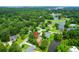 Aerial view of neighborhood with water, mature trees, and landscaped yards at 919 Overview Ct, Mount Pleasant, SC 29464