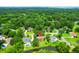 Serene aerial view of a home nestled in a lush, green neighborhood with mature trees and water views at 919 Overview Ct, Mount Pleasant, SC 29464