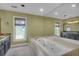 A large bathroom with soaking tub, olive walls, and lots of natural light at 919 Overview Ct, Mount Pleasant, SC 29464