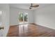 Bright bedroom with hardwood floors, ceiling fan, and sliding glass doors to the deck at 919 Overview Ct, Mount Pleasant, SC 29464