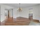 Bright dining room with hardwood floors and a chandelier with views to other rooms at 919 Overview Ct, Mount Pleasant, SC 29464