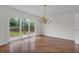 Elegant dining room with hardwood floors, a chandelier, and sliding doors to the deck at 919 Overview Ct, Mount Pleasant, SC 29464