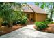 Charming home features a wooden porch, lush landscaping, and a well-manicured lawn at 919 Overview Ct, Mount Pleasant, SC 29464