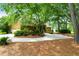 Charming home exterior with mature landscaping, circular driveway, and mature shade trees at 919 Overview Ct, Mount Pleasant, SC 29464