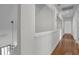Bright hallway with hardwood floors and views of the foyer chandelier at 919 Overview Ct, Mount Pleasant, SC 29464