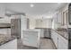 Bright kitchen features white cabinets, stainless steel appliances, and marble countertops at 919 Overview Ct, Mount Pleasant, SC 29464
