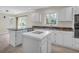 Kitchen with white cabinets, granite countertops, stainless appliances, and a center island at 919 Overview Ct, Mount Pleasant, SC 29464