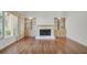 Cozy living room features a fireplace, built-in shelving, and large windows at 919 Overview Ct, Mount Pleasant, SC 29464