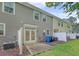Backyard with a small patio, white fence, vinyl siding, and green grass at 9646 Scarborough Ct, Summerville, SC 29485