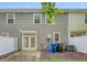 Backyard with a concrete patio, vinyl siding, and trash cans at 9646 Scarborough Ct, Summerville, SC 29485
