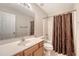 Bathroom featuring a vanity with sink, toilet, and a shower with a curtain at 9646 Scarborough Ct, Summerville, SC 29485