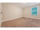 Bedroom with neutral carpet and light-colored walls, lit by a single window at 9646 Scarborough Ct, Summerville, SC 29485