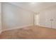 Bedroom with neutral carpet, light walls and trim, and a view of the hallway at 9646 Scarborough Ct, Summerville, SC 29485