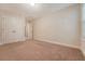 Bedroom featuring neutral carpet, light walls, double closets, and a window at 9646 Scarborough Ct, Summerville, SC 29485
