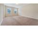 A spacious bedroom with neutral carpet, light walls, and natural light from the two windows at 9646 Scarborough Ct, Summerville, SC 29485