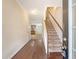 Inviting entryway with hardwood floors and staircase leading to the upper level at 9646 Scarborough Ct, Summerville, SC 29485
