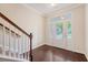 Foyer featuring hardwood floors with staircase and a sunlit front door at 9646 Scarborough Ct, Summerville, SC 29485