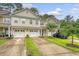 Charming townhouse featuring a two-car garage and a well-maintained front lawn at 9646 Scarborough Ct, Summerville, SC 29485