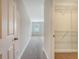 Bright hallway leads to a large room and closet for seamless living and storage at 9646 Scarborough Ct, Summerville, SC 29485