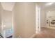 Hallway leading to a laundry room with modern washer and dryer appliances at 9646 Scarborough Ct, Summerville, SC 29485