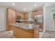 Spacious kitchen features stainless steel appliances, wood cabinets, and a large island at 9646 Scarborough Ct, Summerville, SC 29485