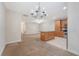 Open floor plan combines the kitchen and living room with a chandelier at 9646 Scarborough Ct, Summerville, SC 29485