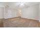 Spacious living room with neutral carpet and multiple entrances at 9646 Scarborough Ct, Summerville, SC 29485