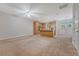 Open-concept living room with neutral carpet and a view of the kitchen at 9646 Scarborough Ct, Summerville, SC 29485