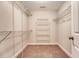 Walk-in closet with metal shelving for maximum storage and neutral colored carpet at 9646 Scarborough Ct, Summerville, SC 29485
