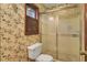 Cozy bathroom with a shower and patterned wallpaper at 103 Kenninghall Rd, Goose Creek, SC 29445