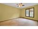 Cozy bedroom with a ceiling fan and large window offering natural light at 103 Kenninghall Rd, Goose Creek, SC 29445