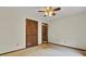 Warm bedroom featuring a ceiling fan and closet with wooden, folding doors at 103 Kenninghall Rd, Goose Creek, SC 29445