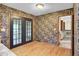 Bright dining area with hardwood floors and french doors that open to the outdoors at 103 Kenninghall Rd, Goose Creek, SC 29445