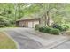 Exterior of home shows the garage and wooded lot at 103 Kenninghall Rd, Goose Creek, SC 29445