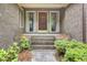Inviting front porch with brick steps leading to the home's entrance at 103 Kenninghall Rd, Goose Creek, SC 29445