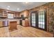 Bright eat-in kitchen with wood cabinets and access to outdoor deck at 103 Kenninghall Rd, Goose Creek, SC 29445