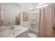 Clean bathroom features a shower-tub combo, neutral decor, and a modern vanity with ample counter space at 104 Orchard Blossom Ln, Summerville, SC 29485