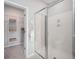 Bathroom showcasing a glass shower and an open walk-in closet with shelves at 104 Orchard Blossom Ln, Summerville, SC 29485
