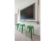 Bonus room features a TV with a wooden frame and three green bar stools at 104 Orchard Blossom Ln, Summerville, SC 29485