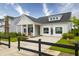 Attractive single-story home with a well-manicured lawn, white siding, and signage for a welcoming appearance at 104 Orchard Blossom Ln, Summerville, SC 29485