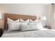 Close-up of the main bedroom highlighting a wooden headboard and decorative pillows at 104 Orchard Blossom Ln, Summerville, SC 29485