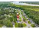Serene neighborhood showcasing houses surrounded by lush trees and a beautiful lake in the background at 1042 Steelechase Ln, Hanahan, SC 29410