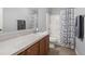 Well-lit bathroom featuring a shower-tub combination and extended vanity at 1042 Steelechase Ln, Hanahan, SC 29410