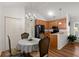 Charming dining area adjacent to kitchen with a chandelier and seating for four at 1042 Steelechase Ln, Hanahan, SC 29410