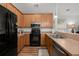 Well-lit kitchen featuring stainless steel appliances and wood cabinetry at 1042 Steelechase Ln, Hanahan, SC 29410