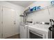 Laundry room with a washer and dryer and wire shelving at 1042 Steelechase Ln, Hanahan, SC 29410